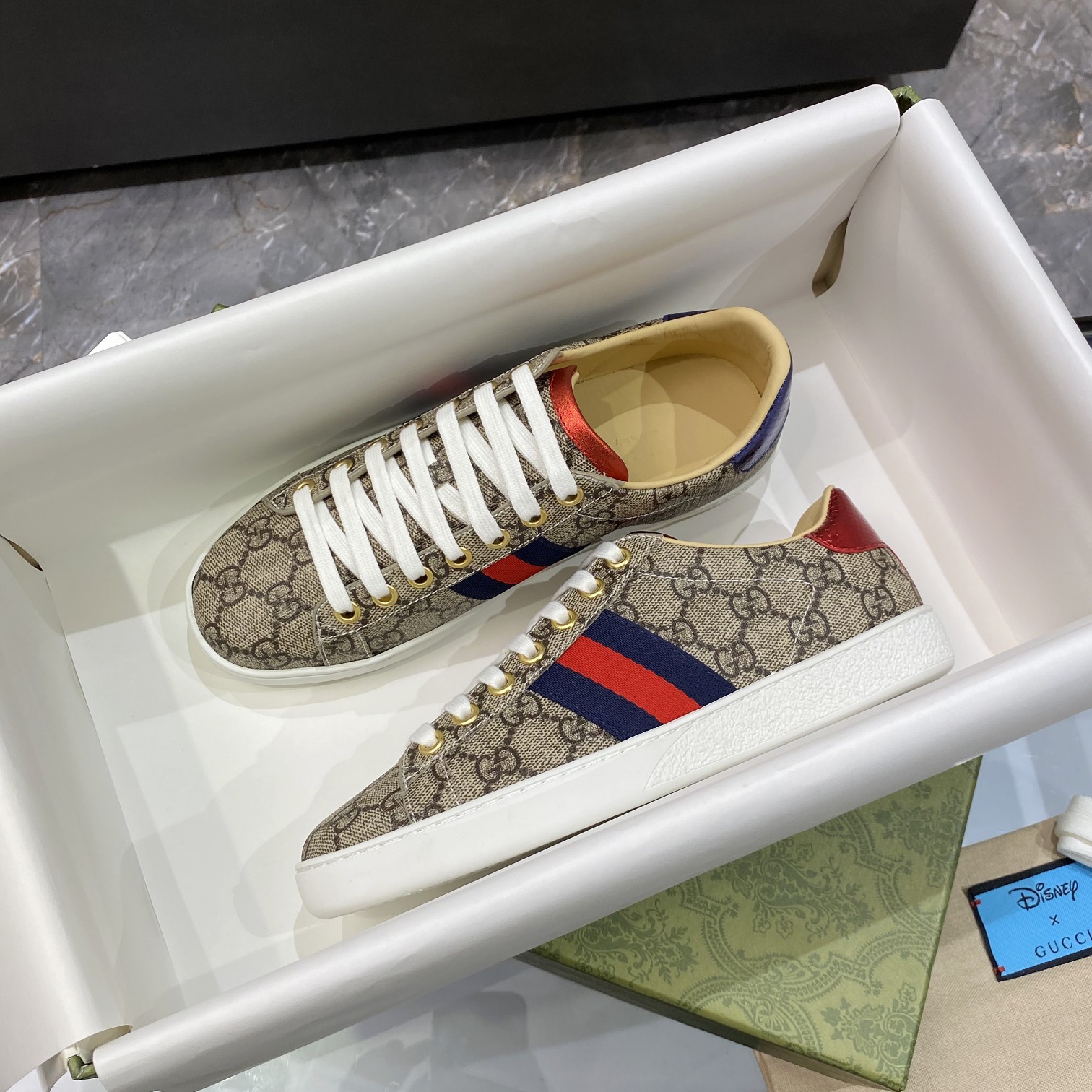 G*u*i sneakers