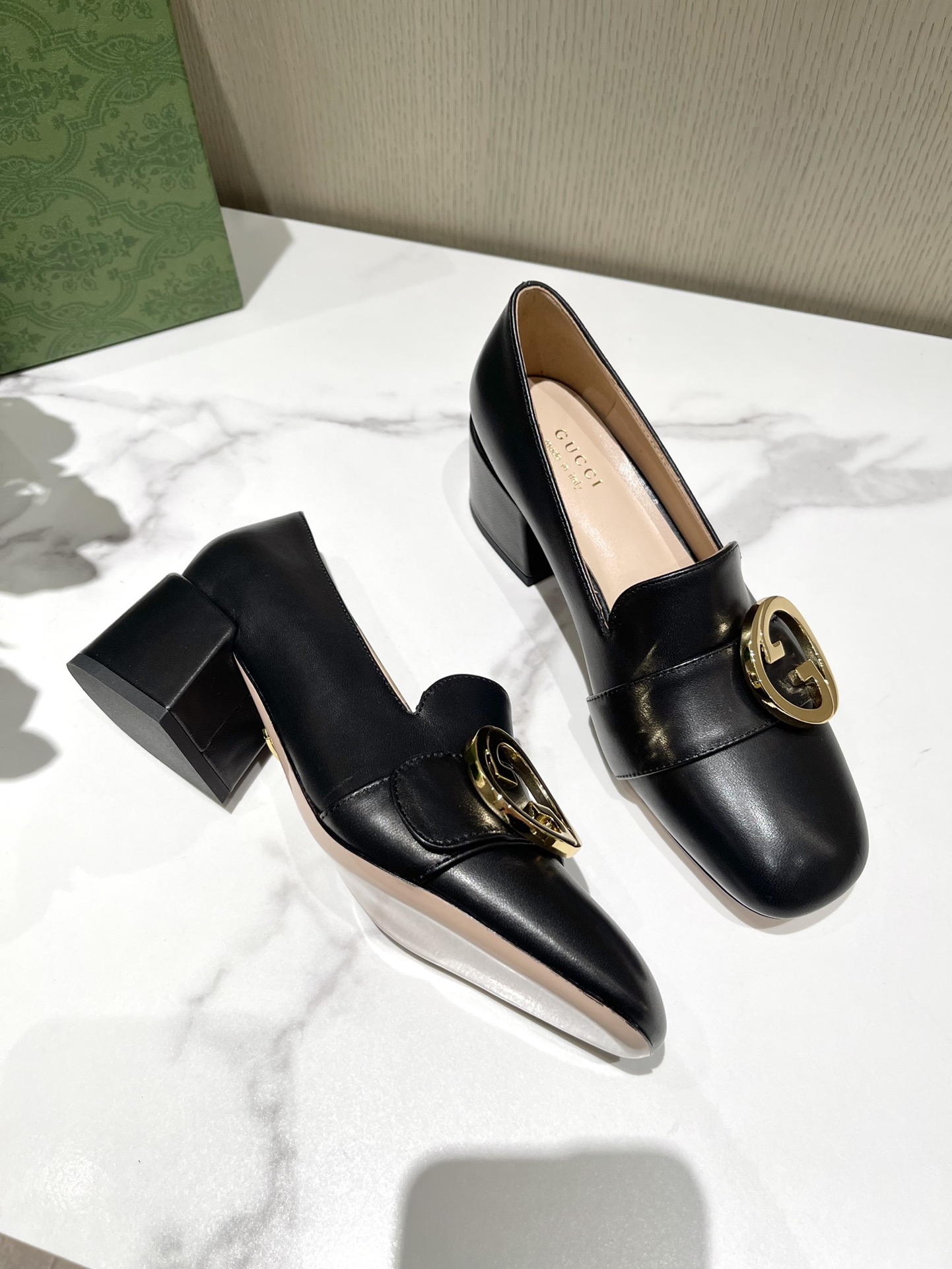 G*u*i loafers