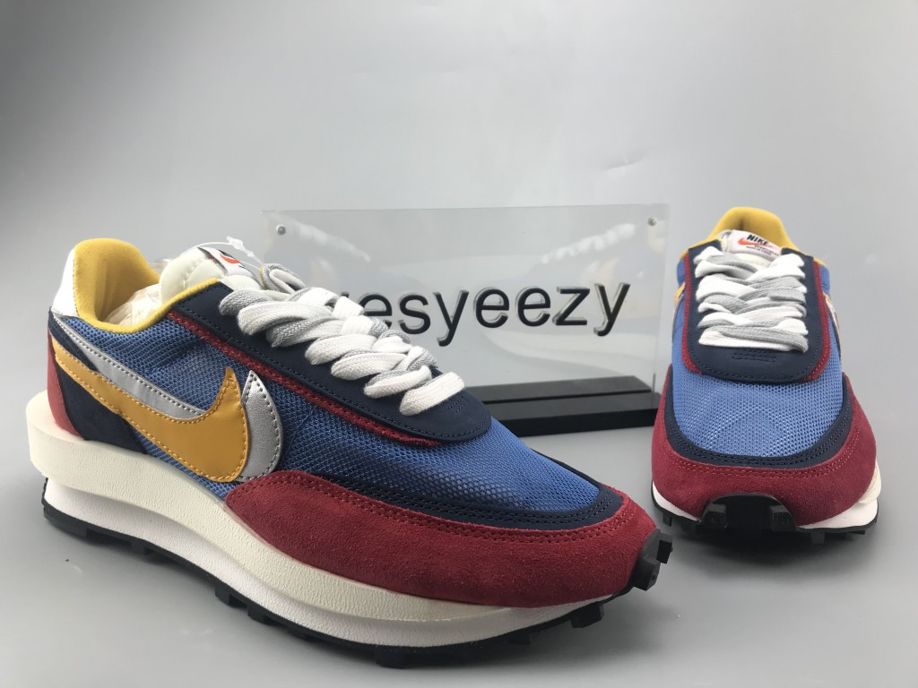 UA NIKE LDWAFFLE/SACAI "VARSITY BLUE"
