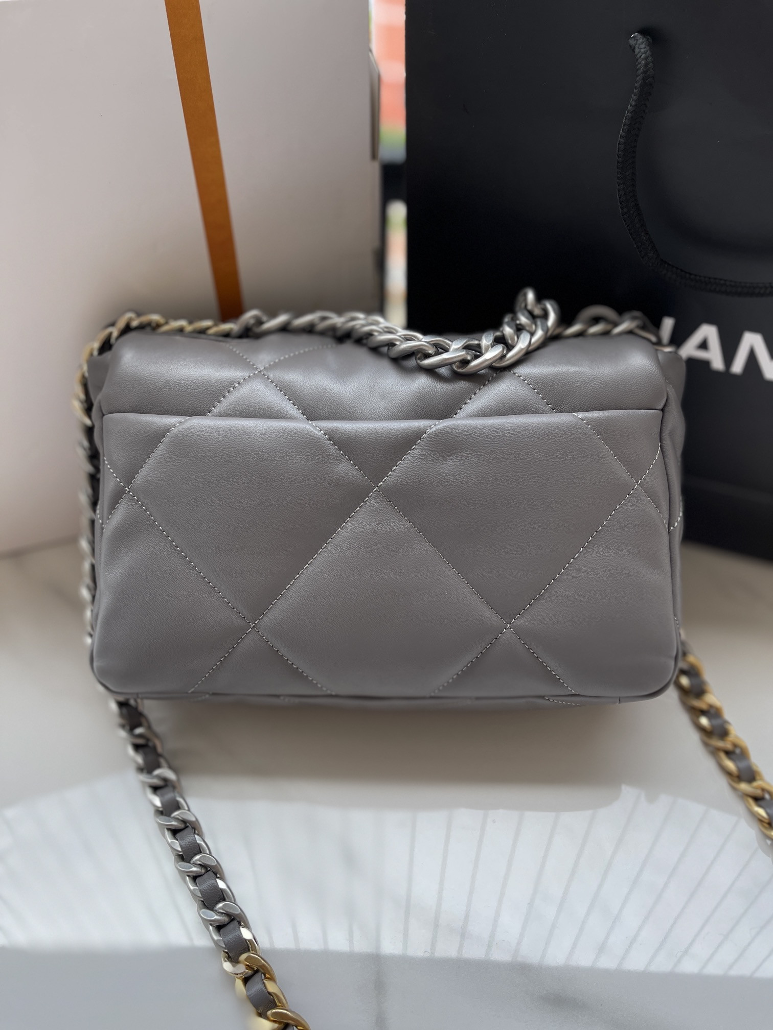 Ch**el 19 HANDBAG Shiny Leather, Gold-Tone, Silver-Tone & Ruthenium-Finish Metal Dark Gray 6.2 × 10.1 × 3.5 in