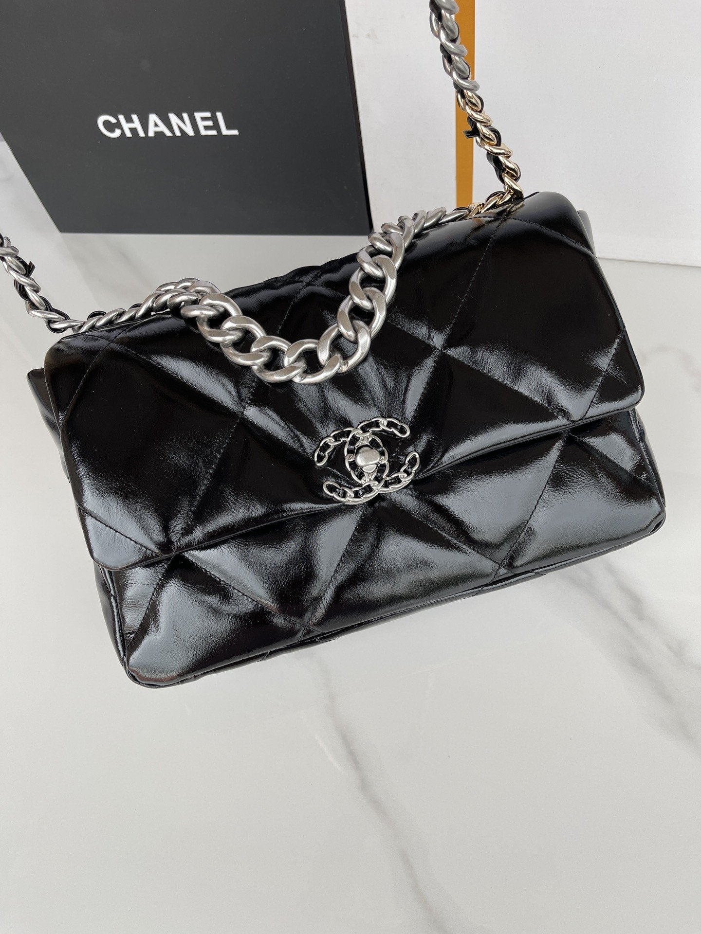 Ch**el 19 LARGE HANDBAG Shiny Leather, Gold-Tone, Silver-Tone & Ruthenium-Finish Metal Black 7.8 × 11.7 × 3.9 in
