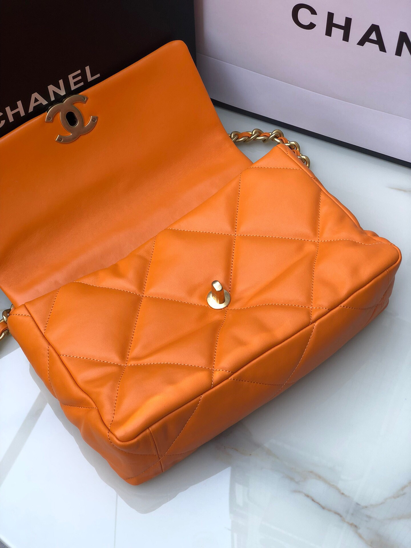 Ch**el 19 LARGE HANDBAG Shiny Leather, Gold-Tone, Silver-Tone & Ruthenium-Finish Metal Orange 7.8 × 11.7 × 3.9 in