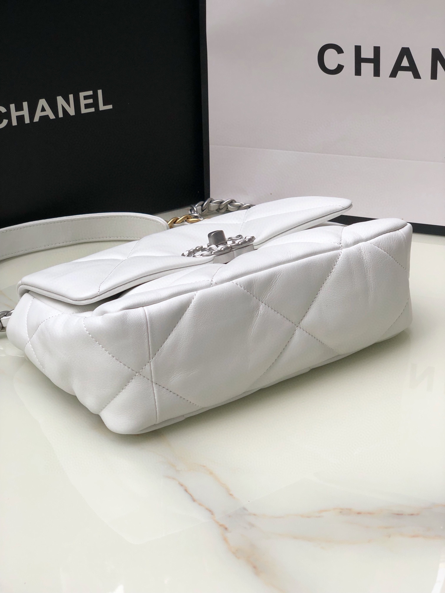 Ch**el 19 HANDBAG Shiny Leather, Gold-Tone, Silver-Tone & Ruthenium-Finish Metal White 6.2 × 10.1 × 3.5 in